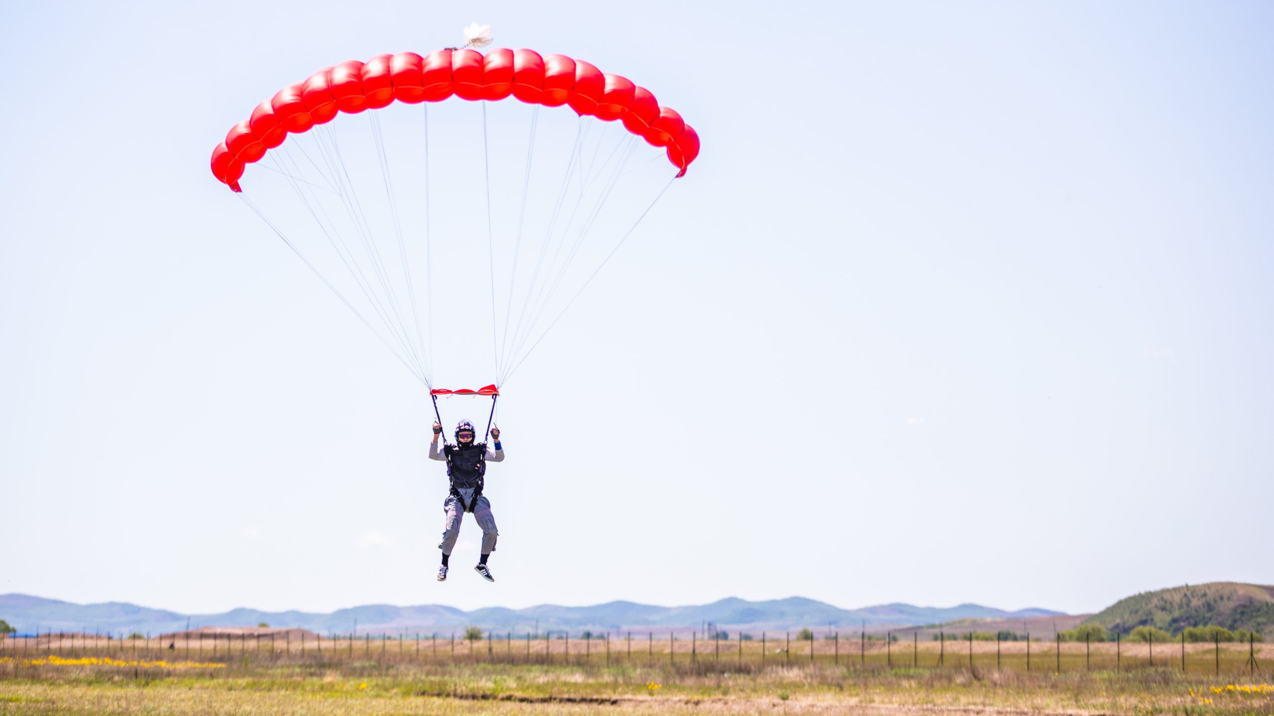 WHA personnel parachute in flight