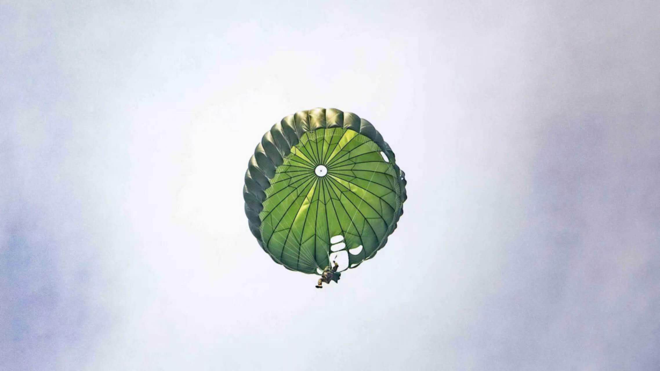 MC1-1 military personnel parachute in flight