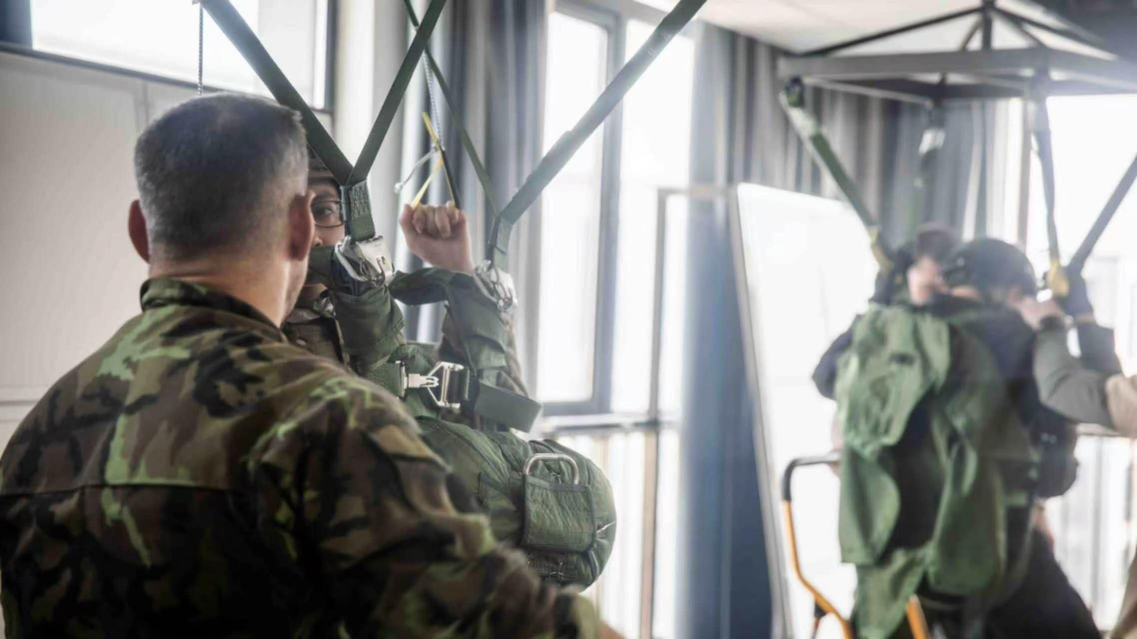 Military parachute ground harness training during Operation Jurchen 2026